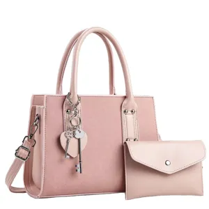 Stylish pink women handbag set, PU leather shoulder crossbody bag with cute charm.
