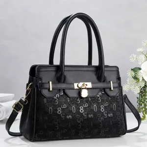 Minimalist black leather tote bag with digital print, metal lock closure and double handles.