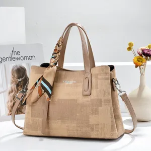 Khaki tote handbag with silk scarf detail, stylish women's commuting shoulder bag for daily use.