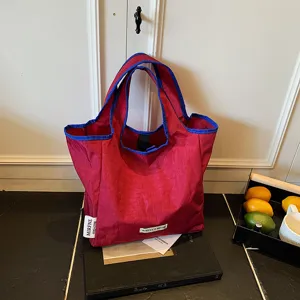 Minimalist red and blue folding tote bag, casual portable shopping bag for women.
