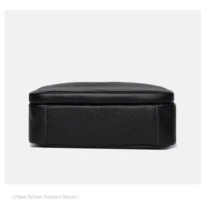 Detailed view of the black leather multi-layer shoulder bag texture and fine stitching.