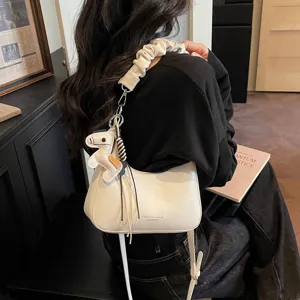 White hobo shoulder bag with scrunchie strap and cute pony charm, casual crossbody bag for women.