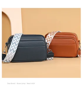 Stylish multi-layer women's shoulder bag with wide geometric strap and large capacity crossbody.