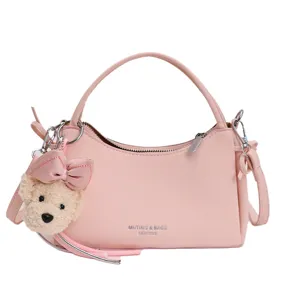 Pink leather handbag for women, chic shoulder crossbody bag with cute bear pendant for daily use.