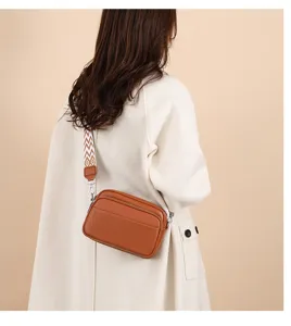 Stylish women's brown leather crossbody bag with patterned wide strap casual daily commute