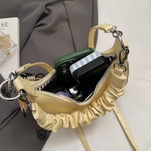 Trendy yellow ruched shoulder bag for women, stylish crossbody tote with spacious interior.