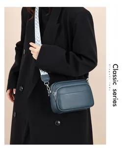 Stylish multi-layer women's crossbody bag with wide strap, perfect for daily commuting.