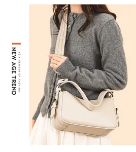 Detailed view of the stylish genuine leather saddle bag, premium cowhide crossbody style.