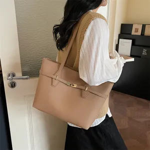 Elegant brown PU leather tote bag for women, large capacity shoulder bag for daily commute.
