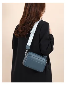 Stylish women multi-layer crossbody shoulder bag with wide woven strap for daily commute.