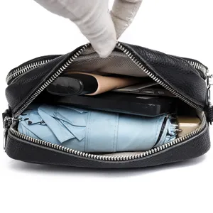 Black multi-layer leather crossbody bag for women, large capacity shoulder bag for commute.