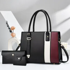 Detailed view of women's color-block handbag set with wallet and cardholder for daily commute.