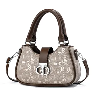 Women's luxury style top handle shoulder bag with chic number print and metal lock.