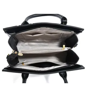 Black PU leather handbag interior detail view featuring multiple compartments and zip pockets.