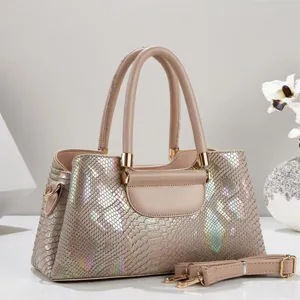 Detailed view of the holographic snakeskin textured tote bag featuring refined metal hardware.