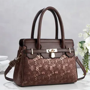 Brown vintage patchwork tote bag with digital print, metal lock and double handles.