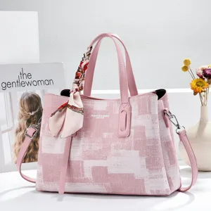 Pink fashion tote bag for women commute, chic pattern handbag with stylish silk scarf decor.