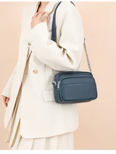 Genuine leather crossbody shoulder bag for women, retro style square design with chain strap.