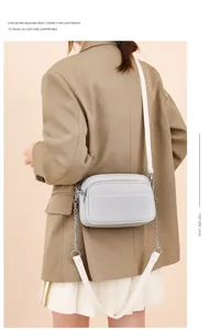 Genuine leather women small square crossbody bag with stylish chain strap and soft texture.