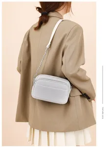 Light grey leather crossbody bag with chain strap, perfect vintage style casual shoulder bag.