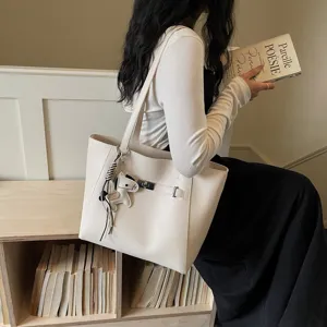Large capacity elegant white tote bag for women, stylish commuting shoulder bag with chic design.
