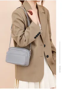 Crossbody leather bag with metal chain strap, versatile retro style for daily chic outfits.