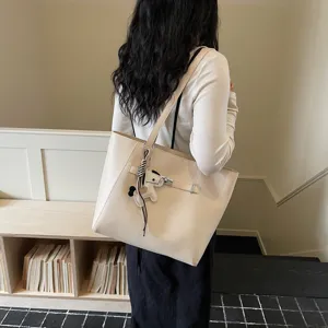 Minimalist beige tote bag for women, large capacity shoulder bag for daily commuting wear.