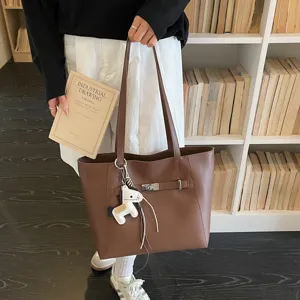 Brown leather tote bag for women, large capacity shoulder bag with horse charm and lock.