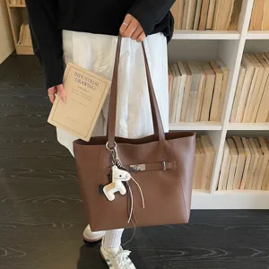 Brown PU leather tote bag for women, large capacity shoulder bag with chic horse charm, daily use.