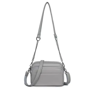 Classic genuine leather women's crossbody shoulder bag with chain strap and soft texture grey color.