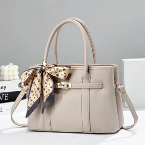 Elegant women's handbag with stylish silk scarf detail, premium tote bag for daily fashion use.