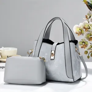 Grey handbag set detail view, casual tote and crossbody bag with gold tone hardware.