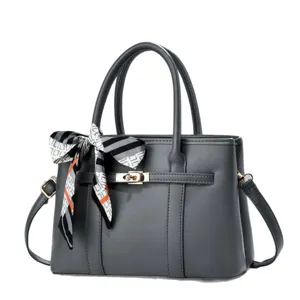 Elegant dark grey women handbag with metal lock and stylish printed twilly scarf, daily use.