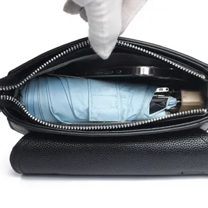 Genuine leather small square shoulder bag interior detail showing large capacity for daily essentials.