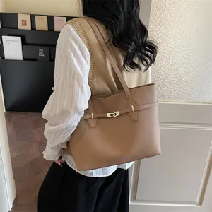 Chic brown leather tote bag for women, stylish large capacity shoulder bag for daily commute.