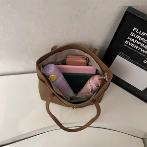 Retro brown leather tote bag for women, large capacity shoulder bag for daily commute.