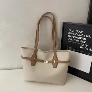 Elegant minimalist leather tote bag for women, large capacity daily commuting shoulder bag.