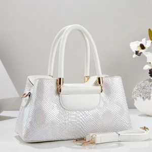 White laser snakeskin textured tote handbag, chic shimmering design with gold hardware.