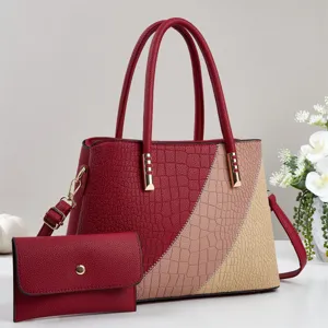 Stylish women colorblocked crocodile texture handbag set with shoulder strap and matching wallet.