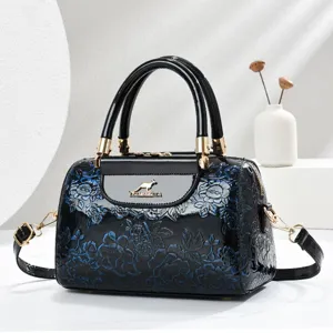Black patent leather embossed floral handbag, stylish top handle shoulder cross body bag for women.