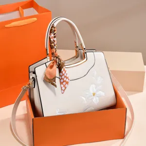 Elegant embroidered women handbag shoulder crossbody bag with stylish scarf decoration.