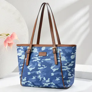Blue camouflage tote bag for women, large capacity shoulder handbag with brown straps and stylish design.