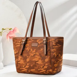 Detailed view of the brown camo tote bag with double handles and fashion metal buckles.