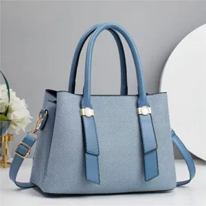 Close up view of the stylish blue tote shoulder bag with premium texture and metal details.