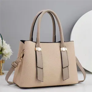 Women's chic woven tote shoulder bag, stylish casual handbag with pearl buckle detail.
