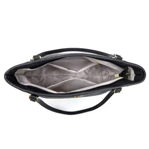 Black leather handbag interior detail view showing multi compartments and zipper pocket design.