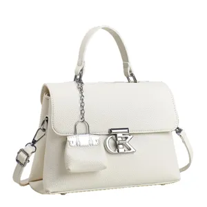 Elegant white leather handbag for women with top handle, metal lock charm and shoulder strap.