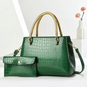 Glossy green crocodile pattern patent leather handbag set with gold braided handle for women.