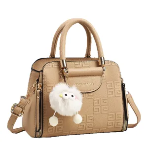 Stylish khaki women handbag with elegant embossed geometric pattern and cute fluffy plush charm.