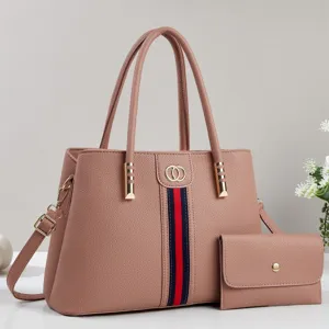 Elegant leather tote bag two-piece set with stylish color-blocking and durable shoulder strap.